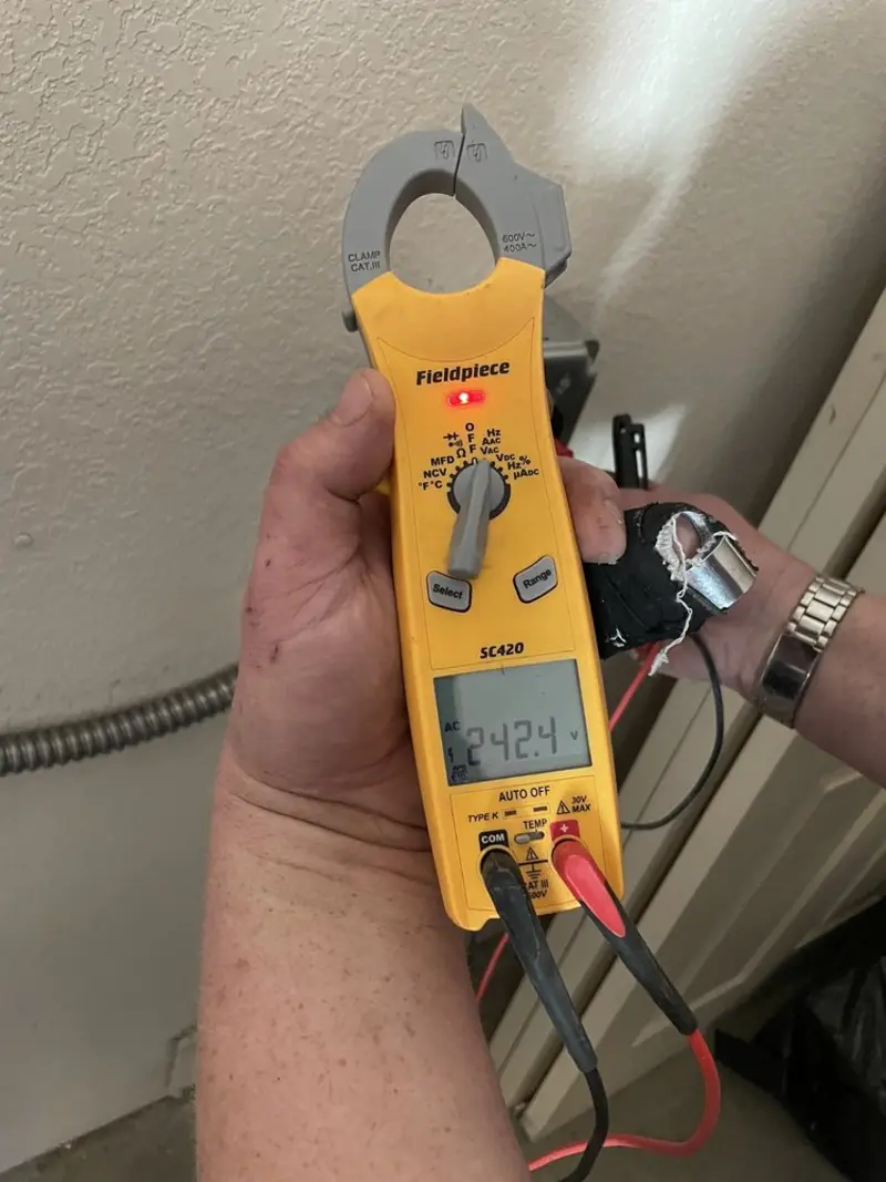 Voltage testing with clamp meter during Generator Installation in Lincoln